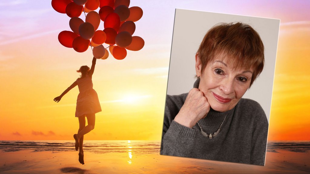 happiness or dream concept, silhouette of happy woman jumping with multicolored balloons at sunset on the beach