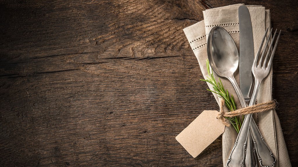 Vintage silverware with an empty tag